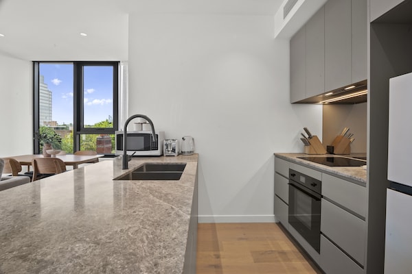 Foto van Gloednieuw appartement in Albert Park met zwembad en fitnessruimte. - Kitchen