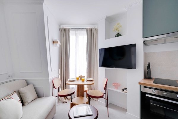 Foto van Prachtig appartement - 1 slaapkamer - 4 slaapkamers - Tour-Eiffel - LivingRoom