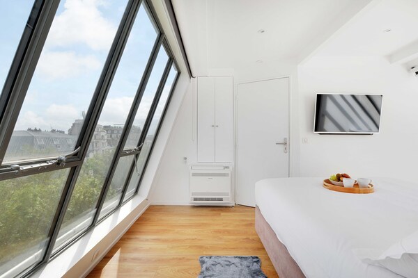 Foto van Uitzonderlijke triplex met terras - Montmartre - Vakantiehuis in Paris - 