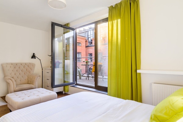 Foto van Loft in het historische Scheibler-gebied - Vakantiehuis in Łódź - BedRoom