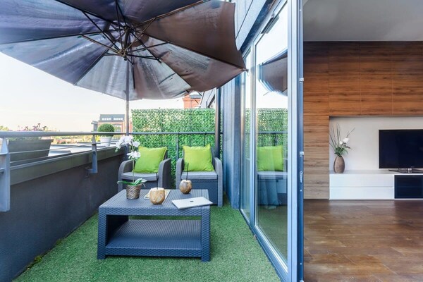 Foto van Loft in het historische Scheibler-gebied - Vakantiehuis in Łódź - TerraceBalcony