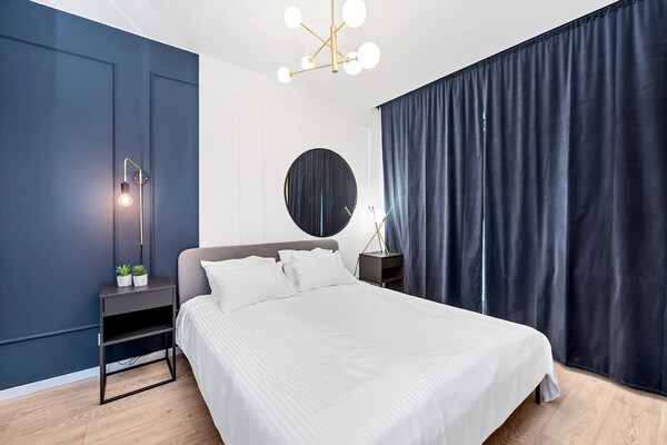 Foto van Elegant appartement nabij de rivier de Vitsula - Vakantiehuis in Łódź - BedRoom